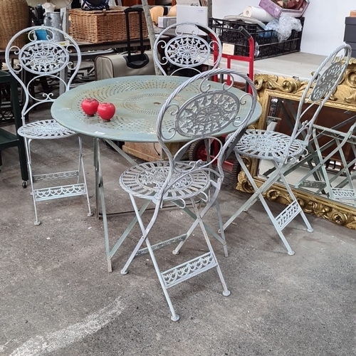 691 - Star lot : A vintage wrought iron garden set including a round table and four intricately designed f... 