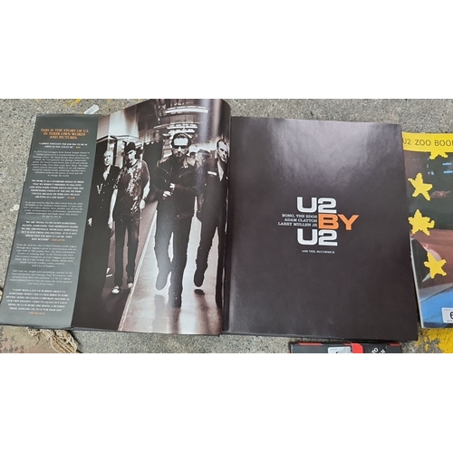 695 - A mixed lot of U2 memorabilia including autobiographical book 