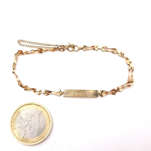 503 - A nine carat gold identity bracelet marked 'Andrea' together with safety chain. Weight - 2.40 grams.