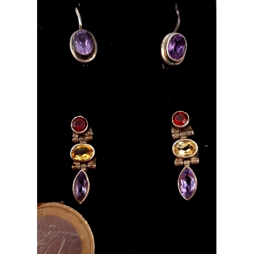 504 - Two pairs of 925 silver earrings. The first a three stone pair of stud earrings (citrine, garnet & a... 