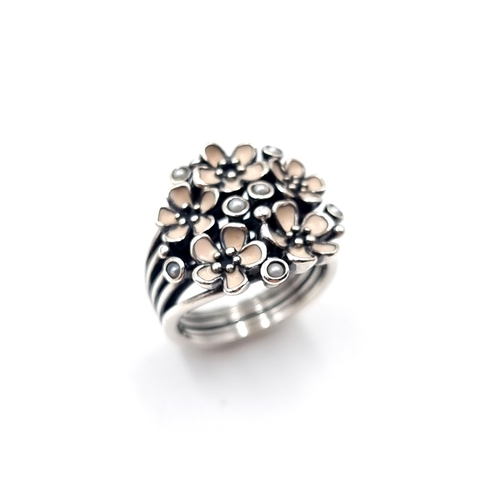 513 - A sterling silver Pandora cherry blossom ring. Size - K. Weight - 7.11 grams. Comes in original box.