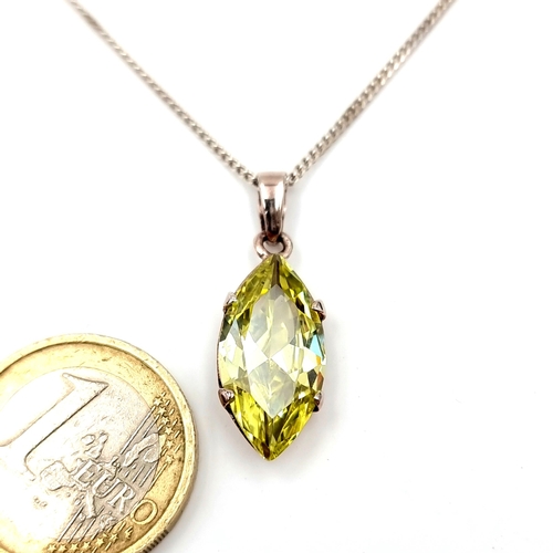 519 - A pear shaped beautiful peridot facet cut pendant with chain set in sterling silver. Length - 44 cms... 