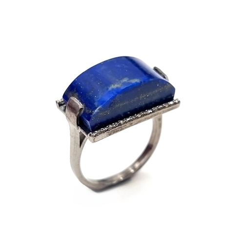 540 - A fabulous large 16 carat  Lapis Lazuli stone ring with diamond surround set in sterling silver. Sto... 