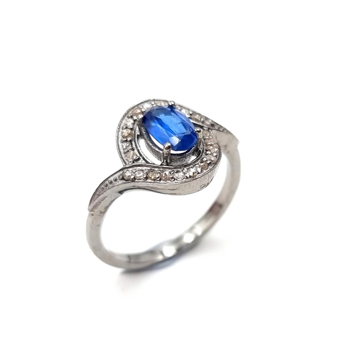 541 - Star Lot : A lovely  Kyanite blue stone ring set with diamond surround of 0.20 carats. Weight - 3 gr... 