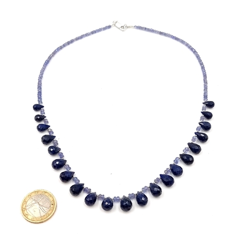 574 - An amazing graduated pear shaped tanzanite and sapphire gemstone necklace. Length - 44 cms. Weight -... 