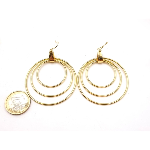 583 - A pair of 14 carat gold plated circlet earrings. Suitable for pierced ears. Weight - 13.44 grams. By... 