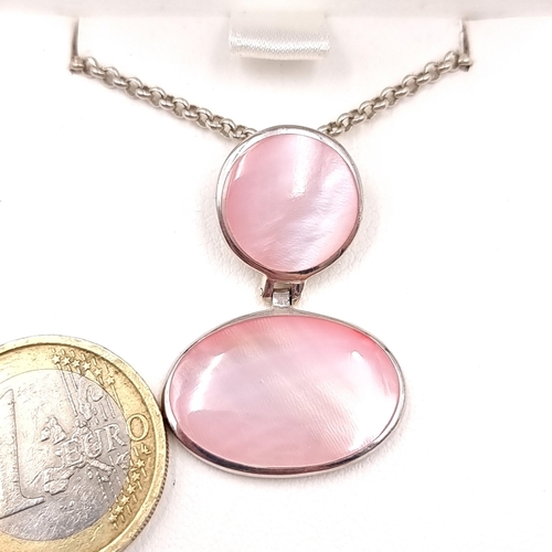 586 - An attractive pink moonstone pendant necklace with silver chain. Length - 42 cms. Comes in original ... 