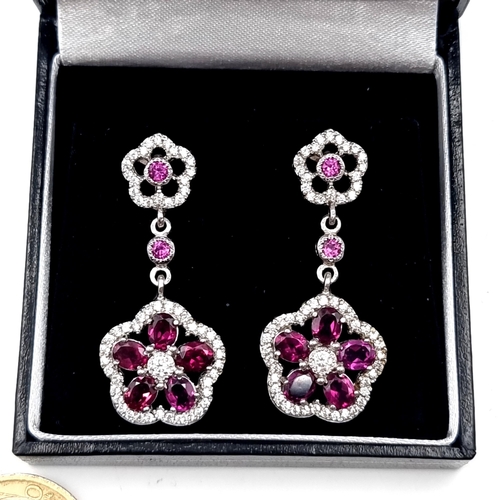 552 - A pair of five stone amethyst gem set stud earrings. Drop - 4 cms. Weight - 10.5 grams. Boxed.