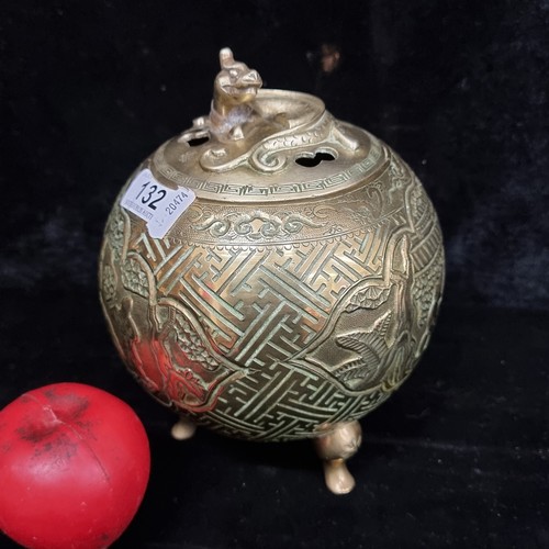 132 - A fabulous antique Chinese footed and lidded heavy brass incense burner featuring ornate and decorat... 