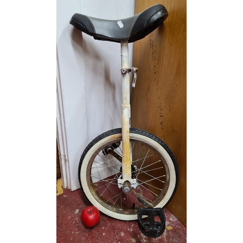 220 - A vintage white alloyed frame uni-cycle. (juggler not included)