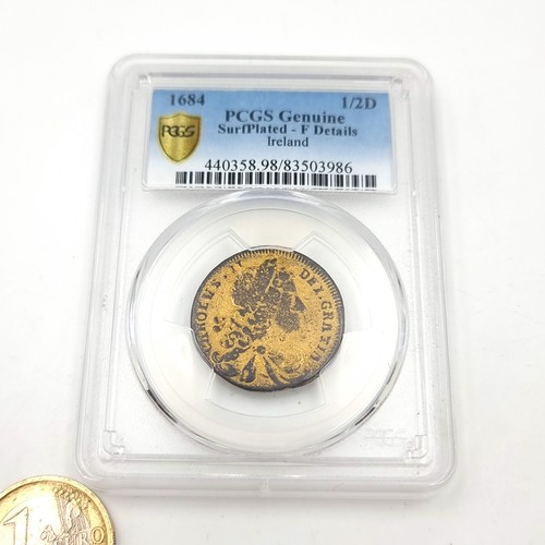 593 - Star Lot : An encapsulated Georgian coin graded as genuine by PCGS. Dated - 1684 1/2D. As per photog... 