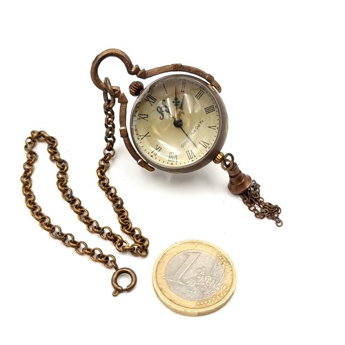 596 - An unusual fob watch with Asian marks set with aperture inspection to reverse. Weight - 33 grams. Wa... 