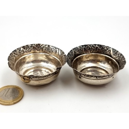 599 - A pair of sterling silver salts with attractive incised detailing to rim. Hallmarked Birmingham - 19... 