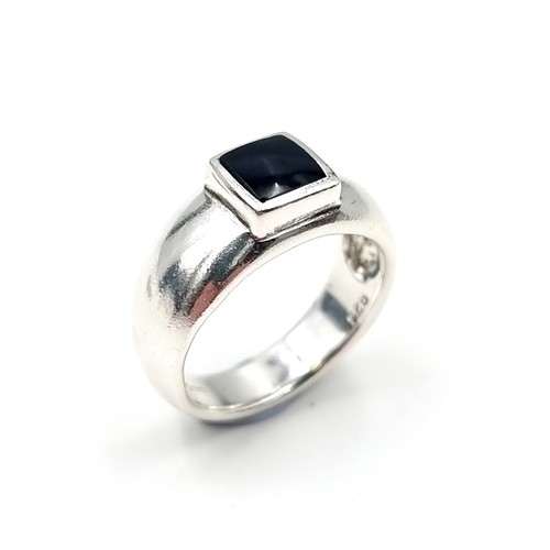 624 - A sterling silver onyx ring. Size - S. Weight - 8.14 grams.