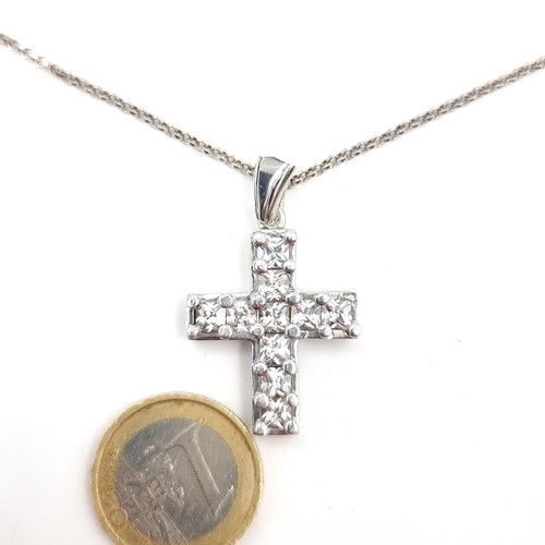 627 - A gem set cross pendant & sterling silver chain. Length - 42 cms. Cross - 3 x 2 cms. Total weight - ... 