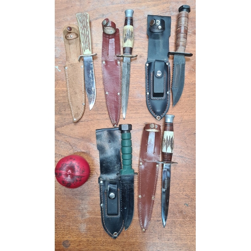 700 - A collection of six vintage fixed-blade hunting knives with sheaths. Various handle materials and de... 