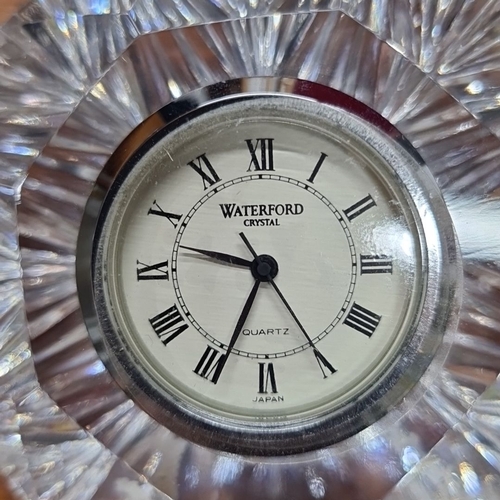 718 - A Waterford Crystal desk clock with quartz movement, featuring a faceted crystal frame, complete wit... 