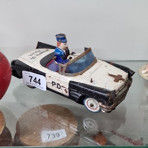 744 - A vintage Japanese Tin Toy Police Car, K.O. Brand, Model 4356. Detailed officer driver in blue unifo... 