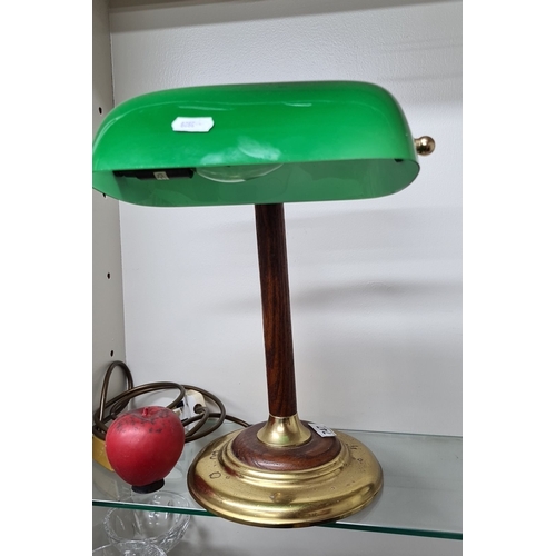 747 - A vintage brass and wood banker’s desk lamp featuring a green glass shade. Classic design with a stu... 