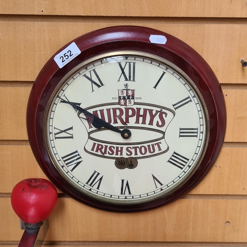 252 - A vintage cherry wood pub Murphy's branded wall clock.