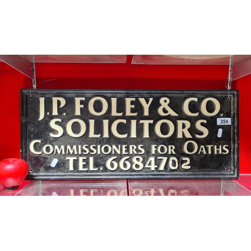 254 - An impressive cast iron  heavy original advertising sign for J.P Foley & Co. Solicitors. 