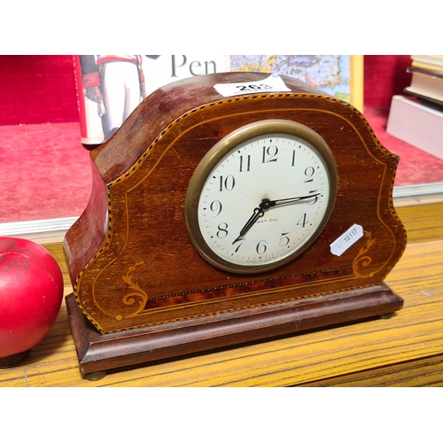 263 - A handsome Edwardian wind up mantle clock boasting beautiful intricate marquetery detail, an eight d... 