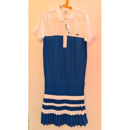 294 - A brand new Lacoste Sport Tennis Dress, size 34, white and royal blue with pleated detail, new with ... 