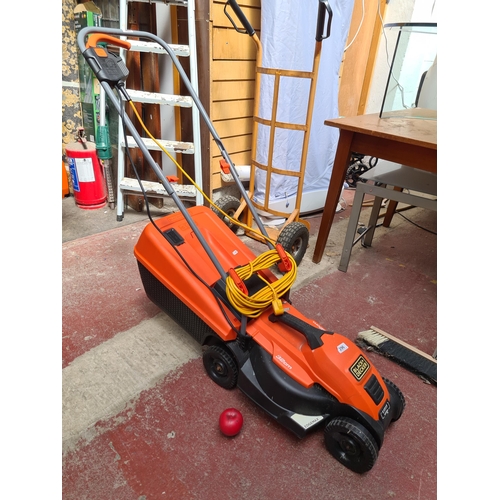 296 - A Black & Decker EdgeMax 32cm lawn mower / grass cutter featuring E-Drive technology. 1200W with 35L... 