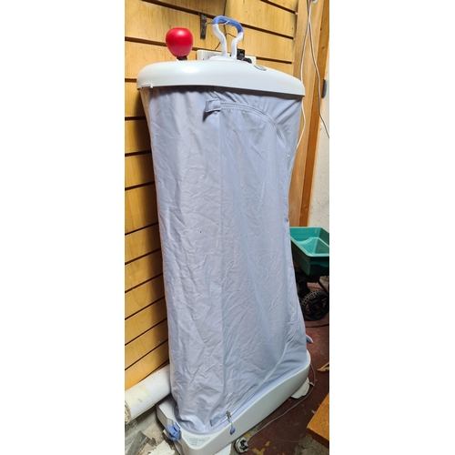 298 - A Whirlpool portable clothes steamer with four different settings-Steaming, Gentle Drying, Cooling a... 