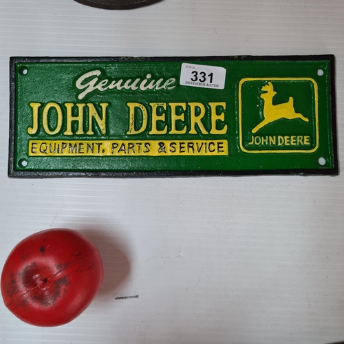 331 - A rectangular cast metal wall plaque for John Deere Equipment & Services.