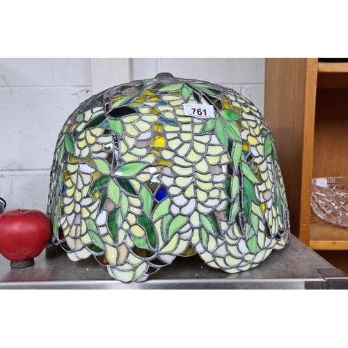 761 - A beautiful large stained glass lamp shade in a floral design featuring green, yellow, and blue glas... 