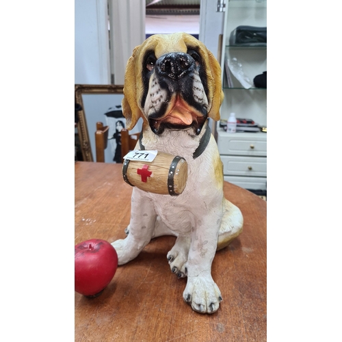 771 - A very cute St. Bernard dog figurine with rescue barrel. Approximate height: 12 inches.