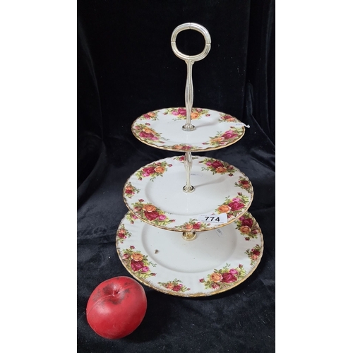 774 - An elegant Royal Albert three-tier cake stand in bone china featuring the Old Country Roses pattern,... 