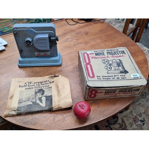 783 - A vintage Horipet-Super 8mm movie projector, battery-operated with original box, includes newspaper ... 