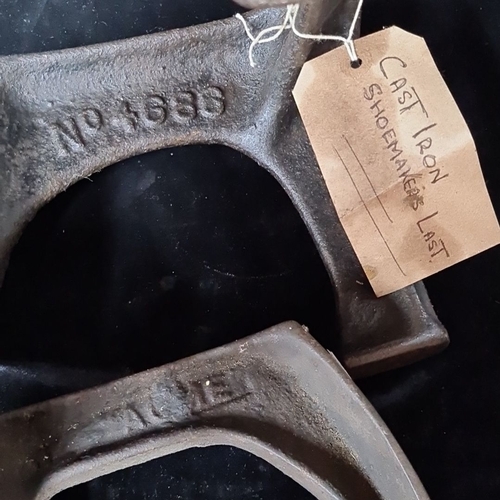 792 - A pair of vintage cast iron shoemaker's lasts, marked No. 8353, and ACME.