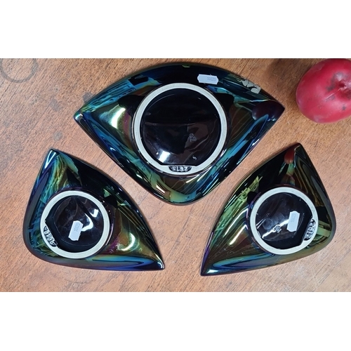 793 - A group of three iridescent ceramic triangular dishes. Marked with 