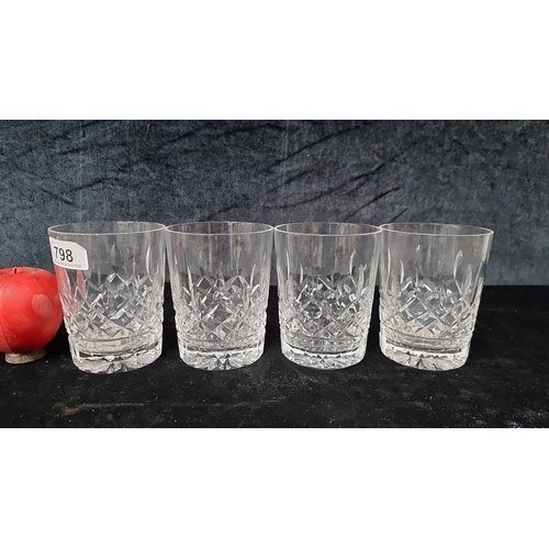 798 - Set of four Waterford crystal 12oz tumblers in the Lismore pattern with intricate cut-glass design. ... 