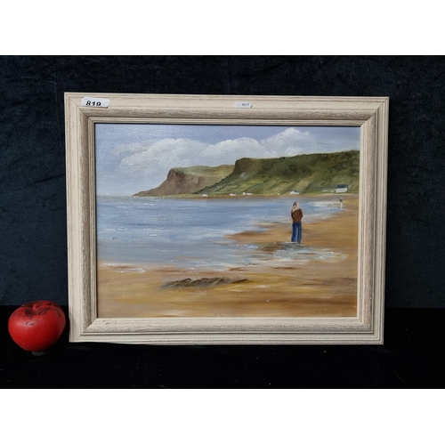 819 - An original oil on canvas painting featuring a breezy coastal landscape with figures. Signed Maguire... 