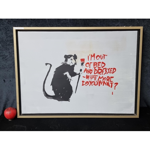 830 - An original acrylic on canvas painting after a Banksy painting. Features a graffiti rat. Housed in a... 