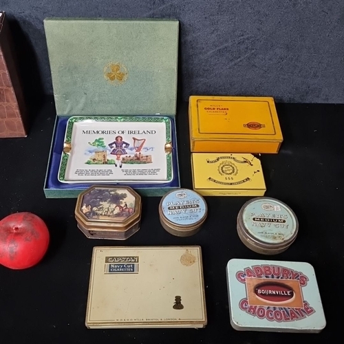 807 - An interesting selection of vintage tins and memorabilia, including 