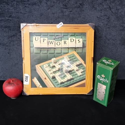 802 - Two board games including 'Upwords' board game by Parker Brothers, and a Carlsberg version of Jenga