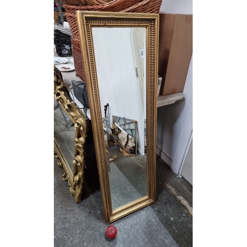 840 - An elegant looking rectangular wall mirror with decorative gold-toned frame, back is ready for hangi... 