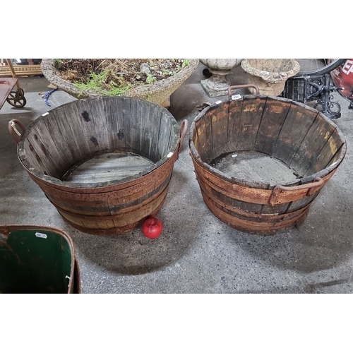 850 - A pair of large vintage wooden coopered Barrell planters  with iron bands and handles.