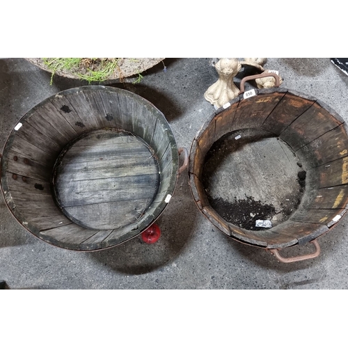 850 - A pair of large vintage wooden coopered Barrell planters  with iron bands and handles.