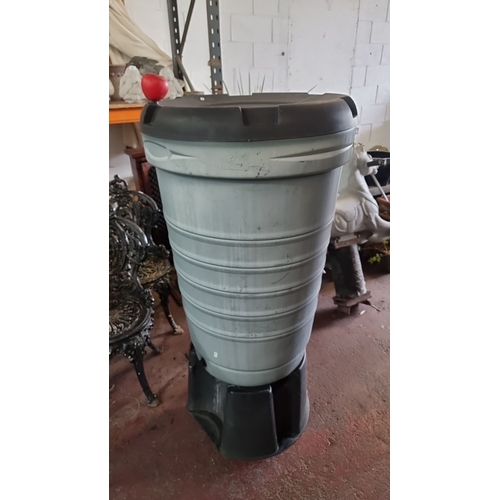 858 - Large plastic rainwater storage barrel with attached spout for easy water dispensing. Suitable for g... 