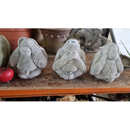 859 - Set of three whimsical stone figurines depicting the 