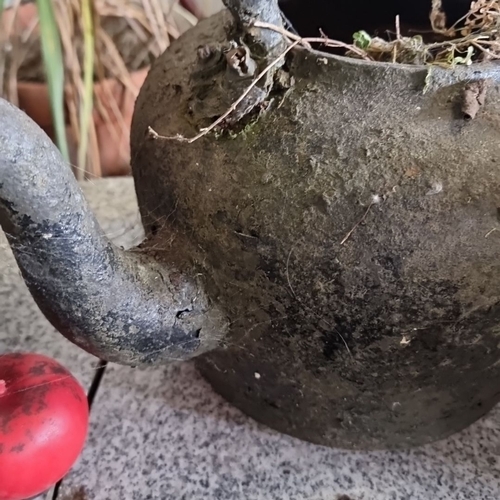 863 - Antique large  cast iron kettle with single curved handle, rustic patina, likely 19th century.