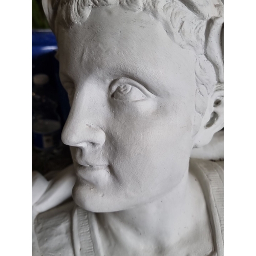 865 - A large bust sculpture, depicting a classical figure, possible Roman or Greek influence. Detailed cr... 