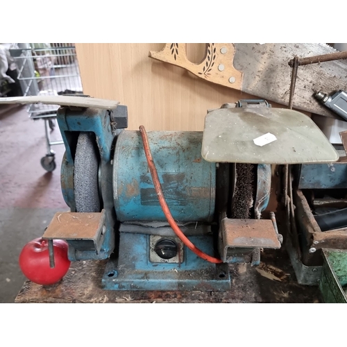 898 - A vintage dual-wheel bench grinder, metal construction with blue finish. Features include on/off swi... 