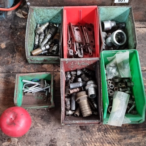 900 - A selection of industrial metal fittings and fasteners, sorted in various bins. Comprising nuts, bol... 